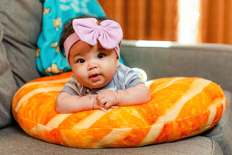 The welcome Home Bundle includes a croissant-shaped baby support pillow.