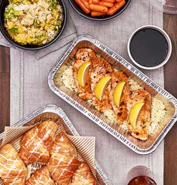 At Cheddar's, get a family bundle of grilled salmon, croissants, and choice of two sides.