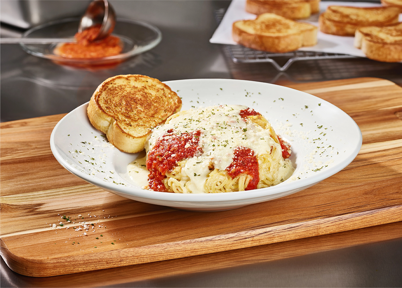 Come to Cheddar's to enjoy our famous Spasagna! Topped with homemade marinara and Alfredo. Order today!