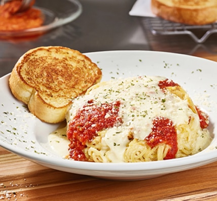 Come to Cheddar's to enjoy our famous Spasagna! Topped with homemade marinara and Alfredo. Order today!
