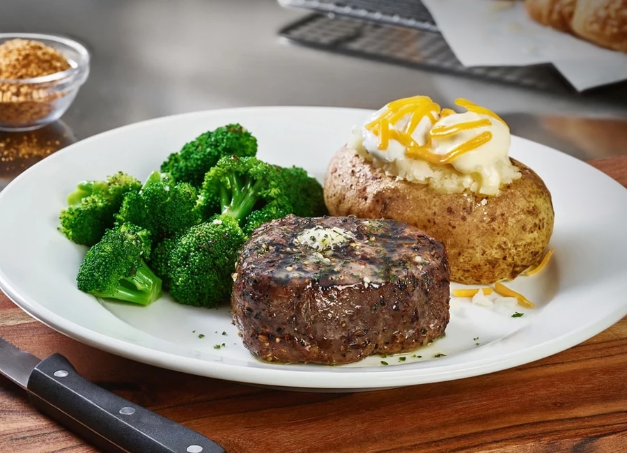 Cheddar's delicious 7-ounce filet next to a loaded baked potato and a side of broccoli.